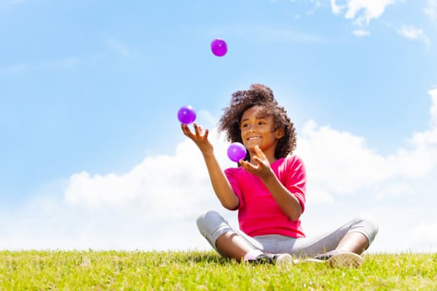 a child juggling