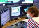 A CERN scientist watches data coming in from Run 3