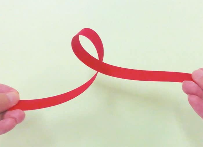 Photograph of a looped paper ribbon