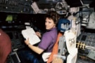 Eileen Collins in the pilot seat of the Space Shuttle Discovery