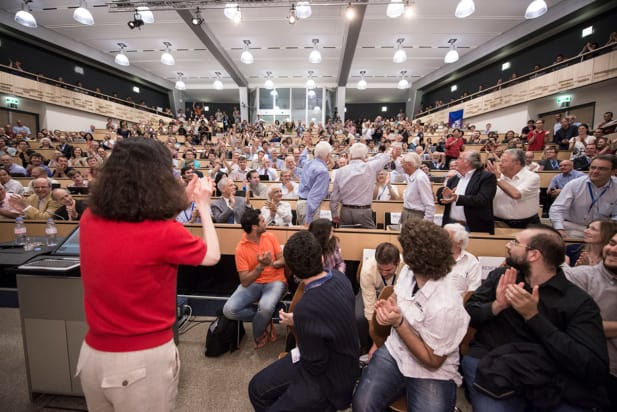 The CERN auditorium on 4 July 2012, filled with scientists applauding the announcement of the Higgs boson